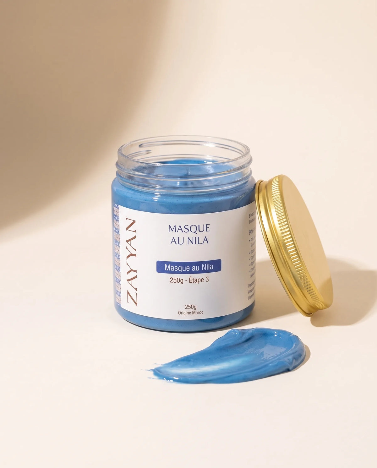 Masque au Nila Zayyan, pot ouvert et texture bleue